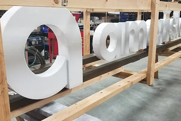 Plastic Illuminated Channel letter signs set up for transport to installation