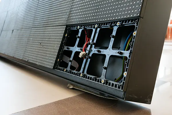 Close up of segment of an electronic scoreboard being repaired