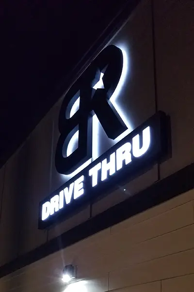 Coffee Shop outdoor halo lit signage at night