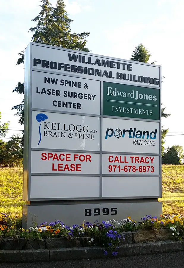 Monument cabinet sign showing multiple businesses